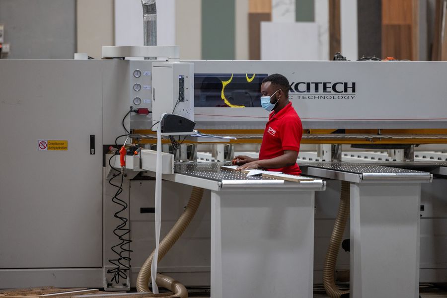 Operator at the Excitech panel saw in the DFWI workshop