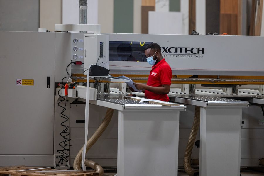 Operator at the Excitech panel saw in the DFWI workshop