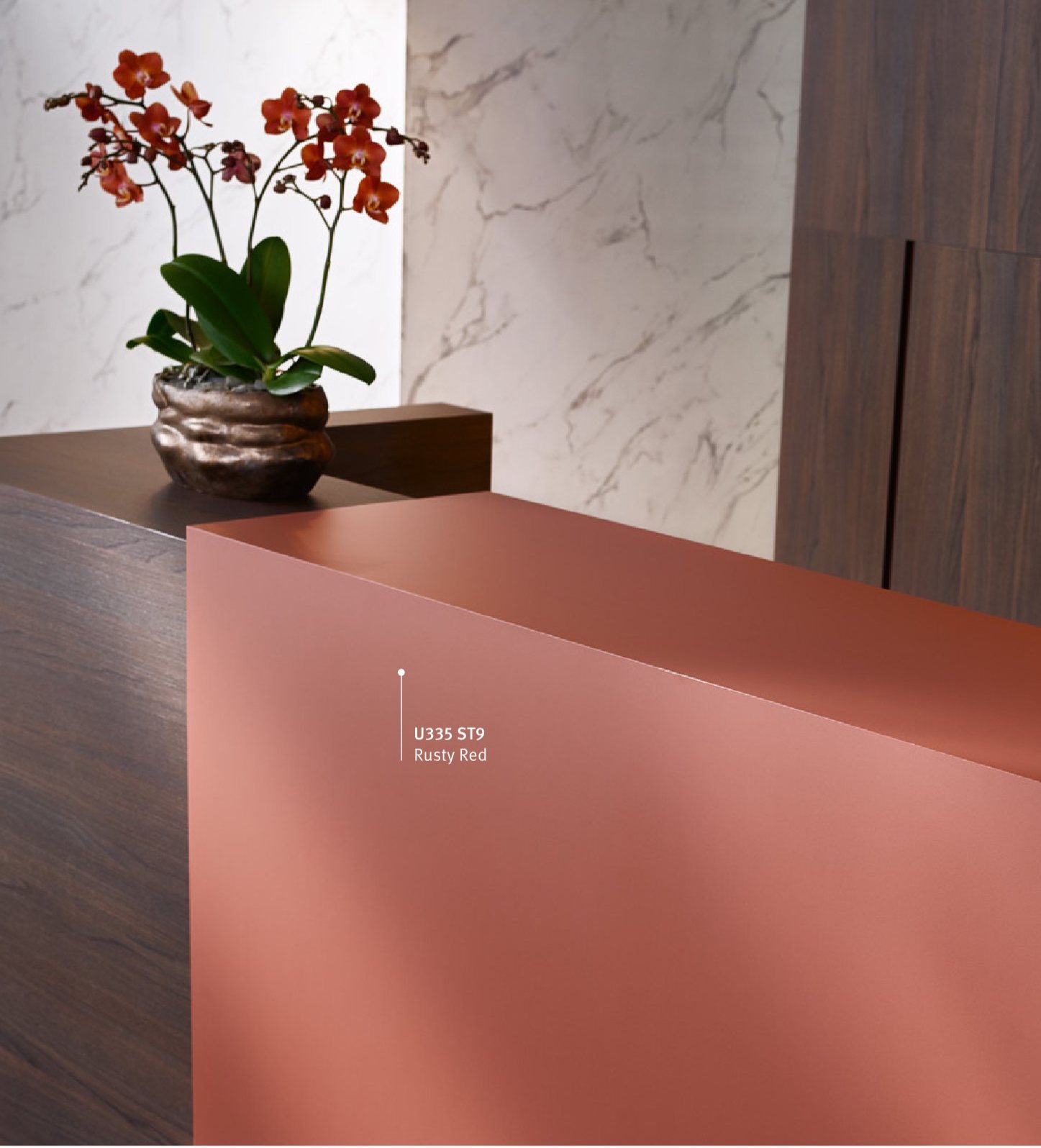 Reception counter in EGGER U335 Rusty Red against a marble wall